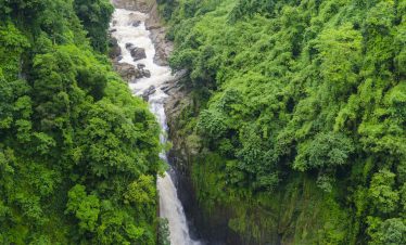 deep waterfall in tropical forest, Asia